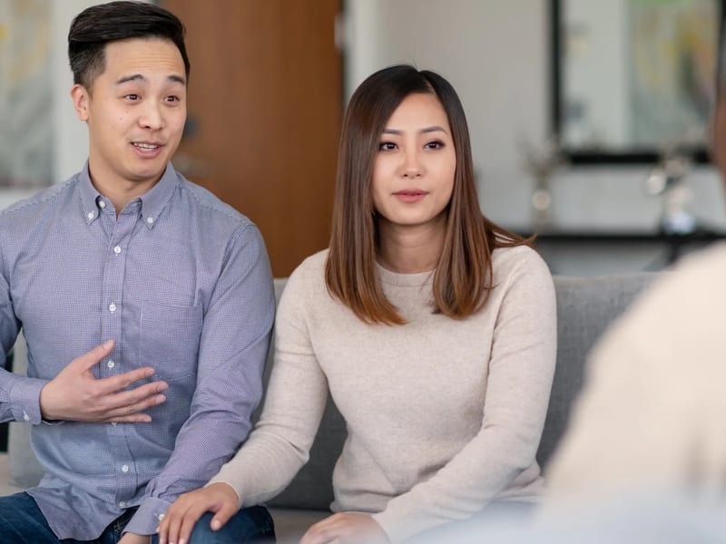 Couple holding hands in therapy